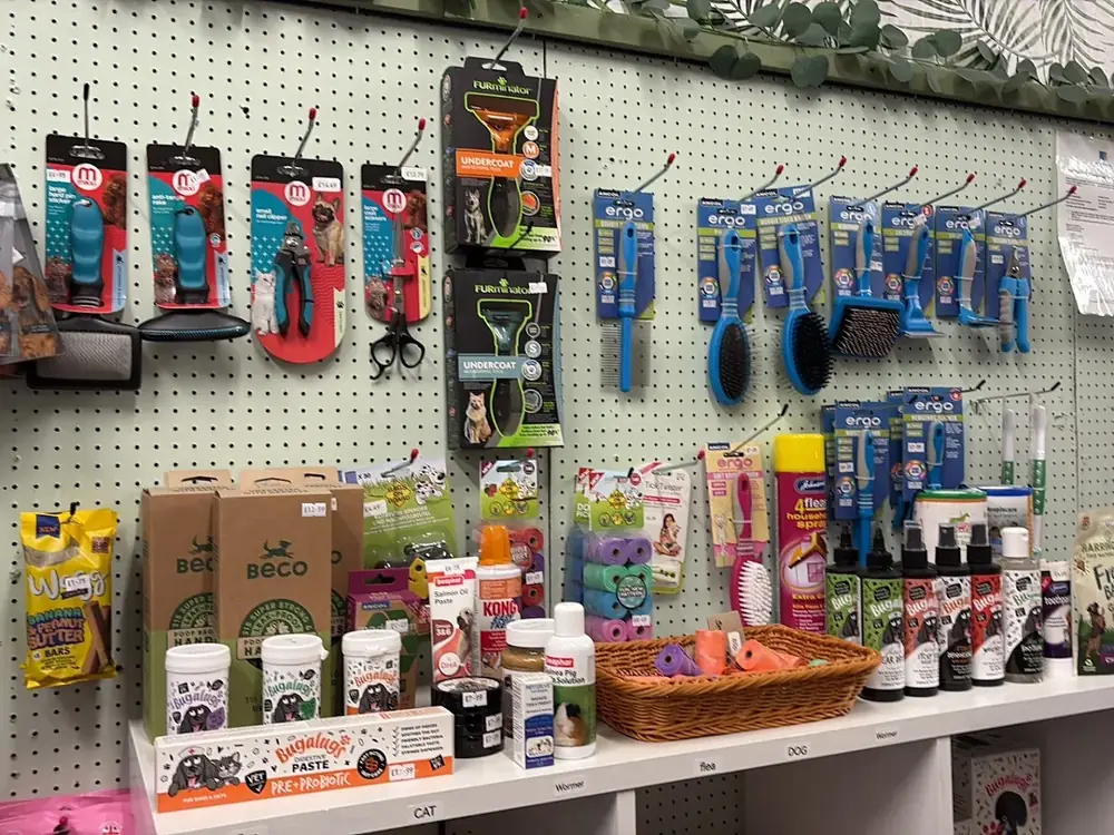 Grooming & care wall — Furminator undercoat tools, Ergo brushes, Beco eco litter, calming sprays and dental care for cats and dogs.